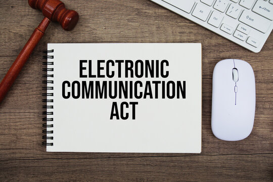 ECA Electronic Communication Act text written on notepad with gavel and keyboard on wooden background