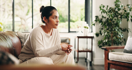 Fototapeta premium Couch, thinking and woman in home with relax for inspiration, break or resting in lounge. Daydreaming, calm and female person in living room for reflection, idea and contemplating on sofa in house