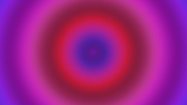 Vibrant abstract radial gradient background with pulsing concentric circles in shades of magenta, purple, and red, creating a hypnotic and energetic visual effect for motion graphics and design