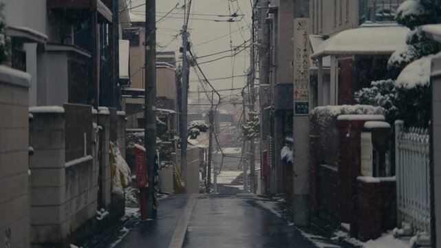Snow falling over quiet residential street in Setagaya Tokyo.