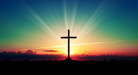 Cross silhouette at sunset with radiant beams