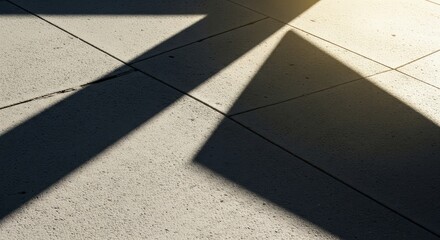 Shadows cast on a textured concrete floor with sunlight geometric shapes and lines