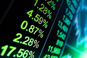 Vibrant green financial stock market display board showcasing dynamic data trends for professional corporate financial analysis, investment advertising, and global trading