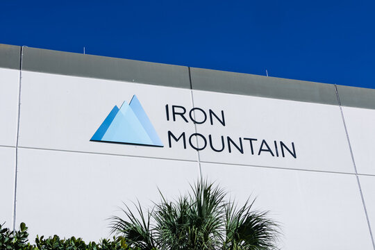 Iron Mountain corporate building facility exterior with branding, provides Data centers and digital solutions, warehouse and logistics.
