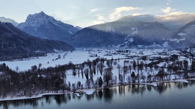 Dramatic sunset over Walensee with mountains from drone.
Golden light above Walenstadt, Amden, Quinten, Mols in Switzerland.