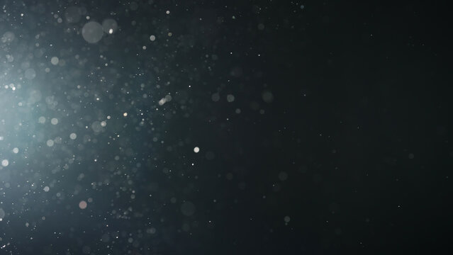 background of particles wave in air over black background and lens flare