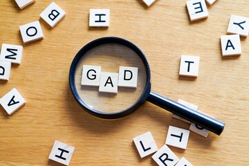 GAD, mental health and medicine concepts. Wooden letters with a magnifying glass on a wooden background © Inspiraciones