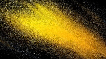 A vibrant yellow powder explosion against a dark background