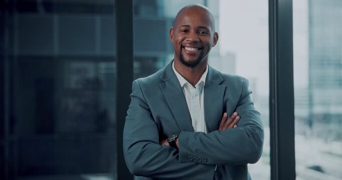 Arms crossed, face and smile of business black man in office for company or corporate management. Confidence, development and professional with happy African employee in city workplace for mission