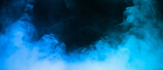 Naklejka premium Colorful smoke with blue flare isolated on a black background. abstract neon gradient cloud with splash. thick swirling dust and powder creating a psychedelic light design. smog effect