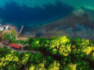 Canoeing and sup standup paddleboarding at  mountains Ziros lake in Preveza Greece at sunrise.