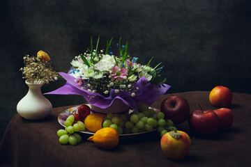 Still life with fruit and a bouquet of flowers
