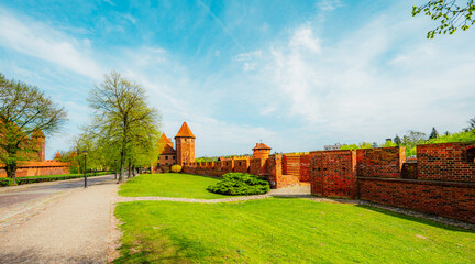 Fototapeta premium Teutonic Malbork castle in Pomerania region with Nogat river in Poland