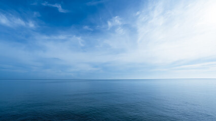 Obraz premium Sky,sea blue ocean background,Horizon beach,water sea ,clear sky,cloud in sunny day.Calm sunrise of soft morning light for summer backdrop,Afternoon sky environment with abstract texture of cloudy