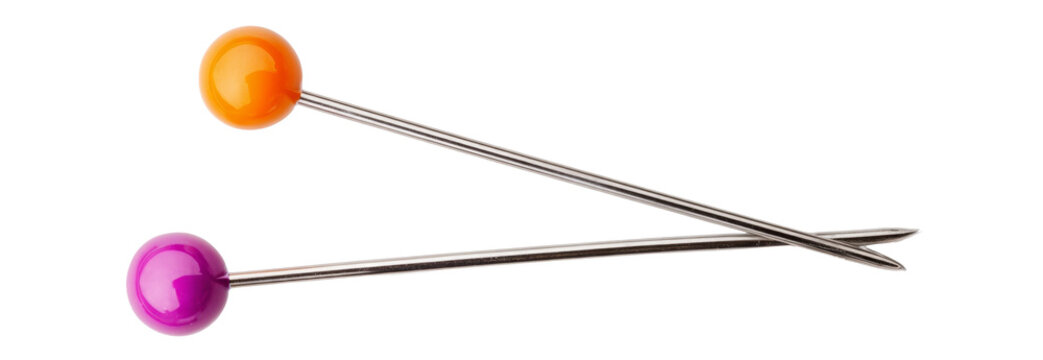 colorful sewing pins on white background