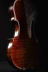 Leandro Biaggi master violin on dark background, luxury classical string instrument close-up, Italian craftsmanship concept