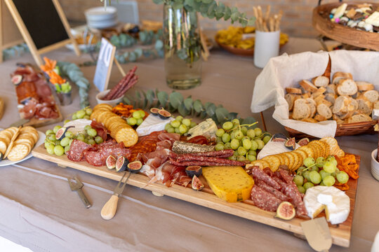 Harvest table of food for grazing on during a party
