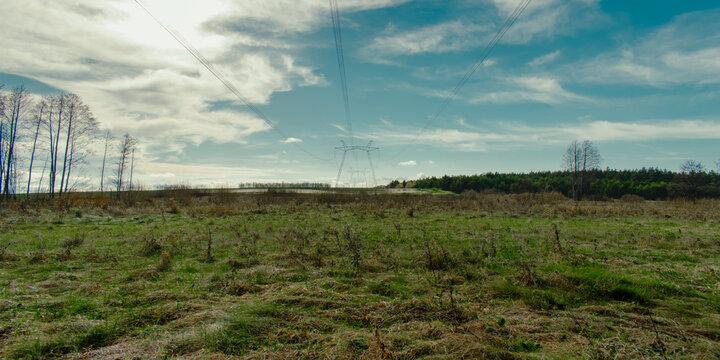 High voltage power lines and electricity pylons in a rural lands