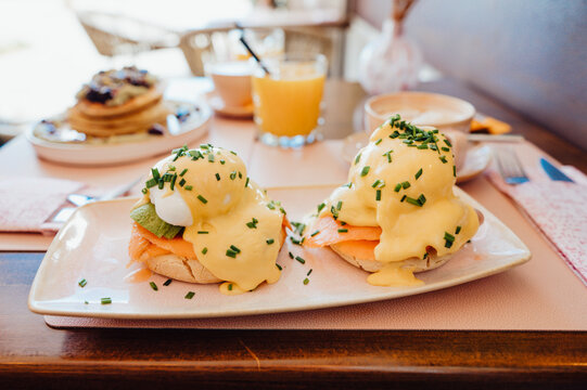 Eggs Benedict with smoked salmon and hollandaise sauce in caf&eacute;