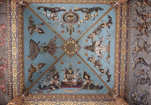 Intricate traditional Buddhist ceiling art and carvings at Patuxay Victory Gate, Vientiane, Laos.