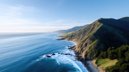 Fototapeta premium Breathtaking Coastal View of Serene Ocean Waves, Dramatic Cliffs, and Lush Greenery Under a Clear Blue Sky in a Picturesque Landscape