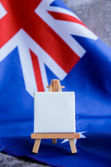 Mock-up for custom copy designs. Clean empty message board next to Australian flag. Place your logo...