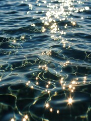 Sparkling ocean surface under afternoon light captures shimmering reflections and moving waves in coastal setting