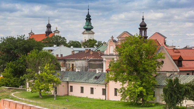 Church tower in the skyline of historic city Zamosc, Poland