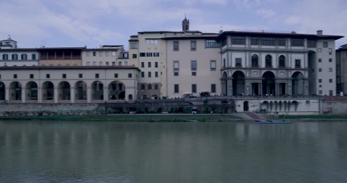 Historic Bridge Wall with Carved Messages Overlooking Arno River, Florence
