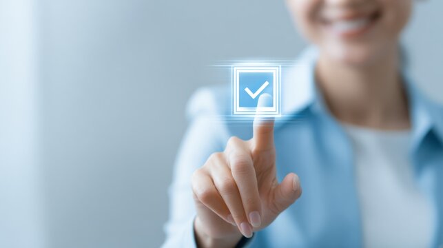 Woman's finger touching a glowing check mark on screen