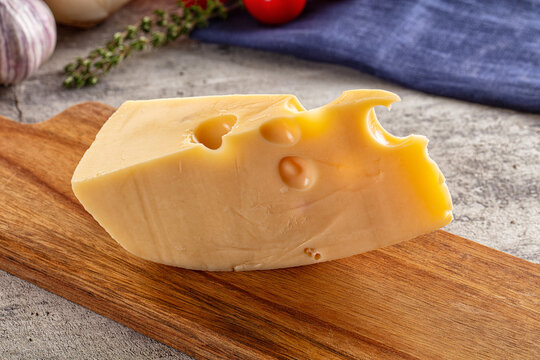 Yellow maasdam cheese triangle piece