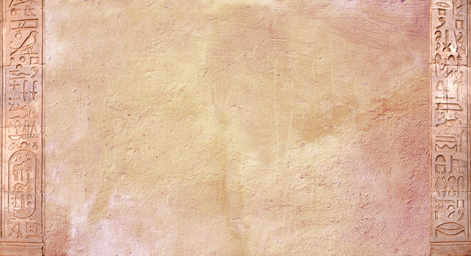 Horizontal background with ancient Egyptian hieroglyphs on stone wall, Egypt, Africa. Backdrop with sandstone carving with hieroglyph. Mock up template. Copy space for text