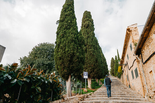 Man walking up El Calvari steps in Pollen&ccedil;a, Mallorca