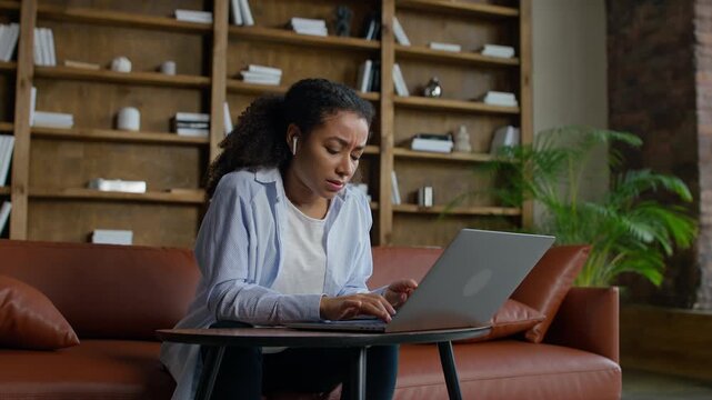 Stressed Entrepreneur Working on Laptop at Office