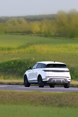 Luxury SUV car on a winding road