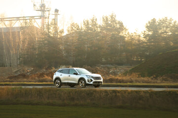 Family vehicle driving on highway through countryside