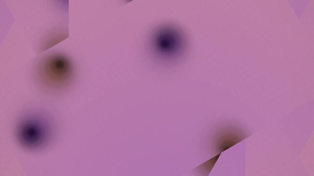 Blurry Black Spots on Pink Background.