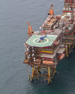 United Kingdom, United Kingdom - 15 February 2026: Aerial view of an offshore oil rig platform standing firm amidst the vast, deep blue sea, a testament to human engineering.