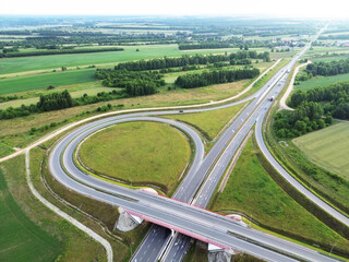 Aerial photo of highway intersection surrounded by farmland