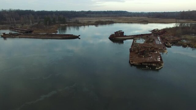 Drone footage of abandoned, rusting ships in the Chernobyl ship graveyard, Ukraine; a haunting reminder of the 1986 disaster.