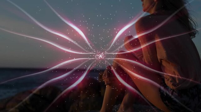 Woman sitting on rocks, core appearing, ribbons glowing, rising, responding, tech guiding gaze