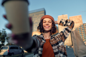 Woman smile coffee shopping urban candid beanie portrait: a joyful moment of authenticity and...