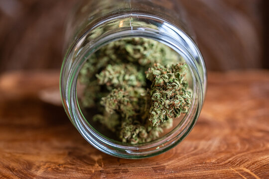 Glass jar full of dried cannabis marijuana buds