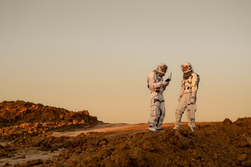 Astronauts exploring terrain during Mars mission simulation © Tetiana Tuzyk