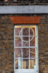 LONDON, ENGLAND: Imagine clocks through a window at the Royal Observatory in Greenwich.