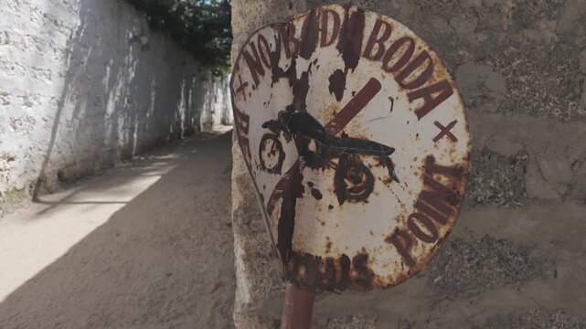 Boda boda motorbikes taxi forbidden sign Lamu county, Lamu town, Kenya