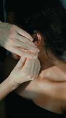 Naklejka premium Therapist providing soothing ear massage with soft lighting ambiance