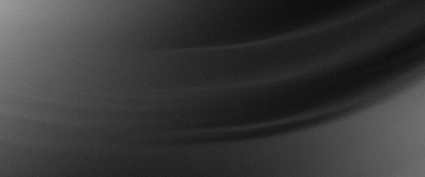 A grayscale image with a textured surface and curved lines