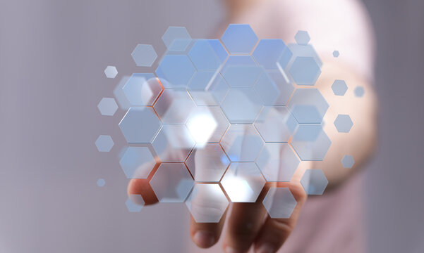 Abstract hand touching a hexagonal network representing digital technology. Concept for future innovation, internet, dat
