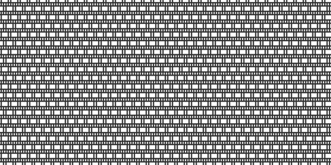 A seamless gray metal grid background features a geometric mesh pattern and dark textured material design for a modern abstract wallpaper backdrop